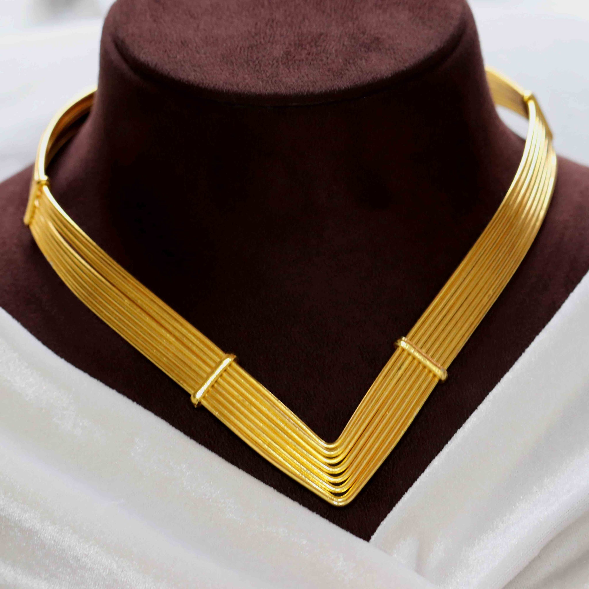 Janaksh handmade brass golden plated statement hasuli necklace