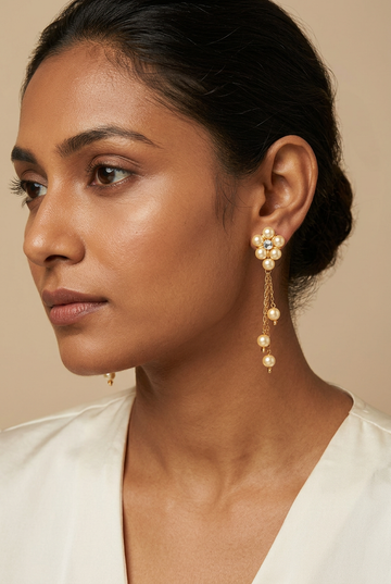 Model wearing the cream-pearl chain earrings